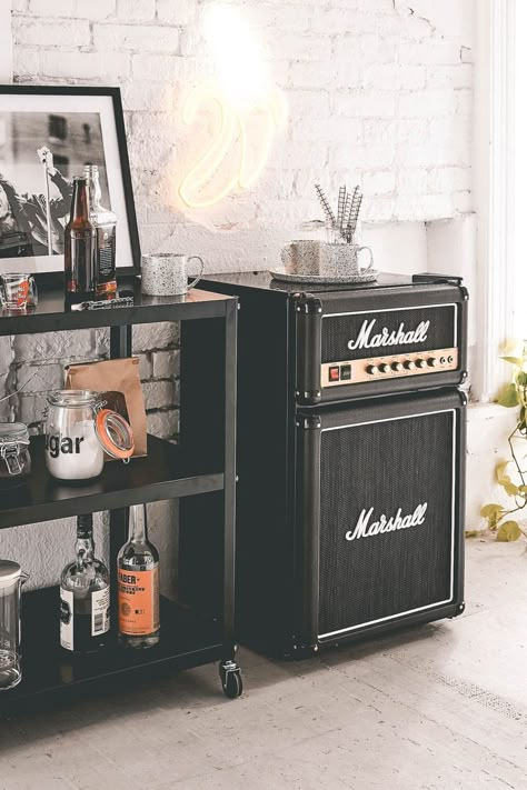 A Fridge that looks like an amp sits next to a bar cart in a aesthetically vintage looking home. Mini Fridge In Bedroom, Casa Rock, Bar Fridge, Mini Refrigerator, Cool Dorm Rooms, Music Studio Room, Casa Country, Man Room, Studio Room