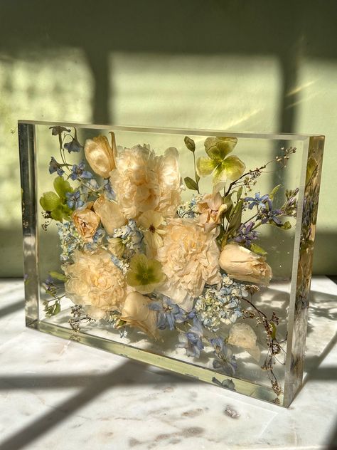 Create a lasting memory of your wedding day by preserving your flowers in a custom resin tray. This one-of-a-kind keepsake is a beautiful way to keep your special day close, every time you use it. 🌸✨ Resin Bouquet Wedding Flowers, Resin Wedding Flowers, Resin Flower Preservation, Resin Keepsake, Resin Wedding, Wedding Flower Preservation, Resin Trays, Bridal Bouquet Summer, Wedding Bouquet Preservation