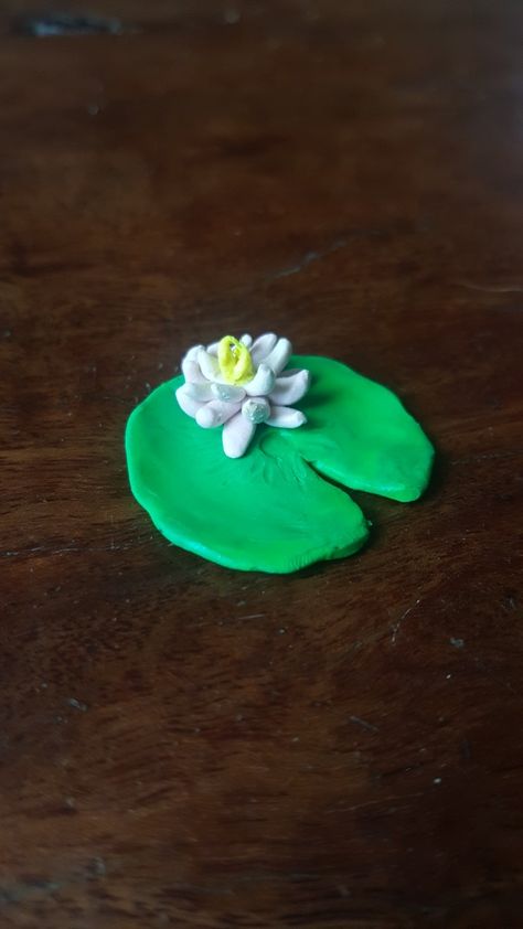 Polymer clay lily pad and flower Clay Lilly Pad Flower, Polymer Clay Fairy Garden Diy, Clay Lily Pad, Clay Lily, Faerie Garden, Bake Clay, Frog Pond, Clay Christmas Decorations, Cottagecore Jewelry