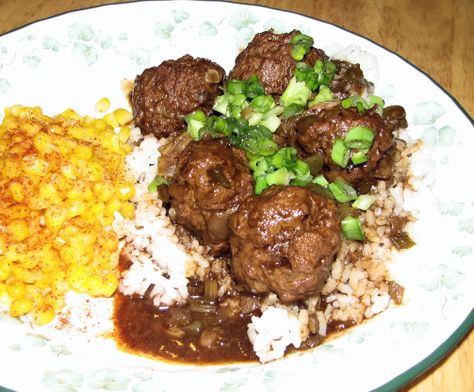 This is a very popular recipe in the Cajun part of South Louisiana, which is frequently referred to as Acadiana. If there's one thing we folks in Acadiana love, it's our rice and gravy! I have often said that when I die, if wherever I end up doesn't have rice and gravy, I'll know I didn't make it to Heaven. Cajun Meatball Stew starts off with your typical dark brown roux. Some people prefer to buy it in stores, ready made. I've never understood why, because it's not that difficult to make f Cajun Meatball Stew Recipe, Cajun Meatballs, Meatball Stew Recipe, Meatball Stew, Rice And Gravy, Meatballs And Gravy, Cajun Dishes, Cajun Creole Recipes, How To Cook Meatballs