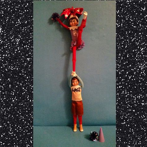 Daughter is a cheerleader so those elves were stunting when we woke up the other morning! Crazy! 2014 ideas Elf On The Shelf Ideas Cheerleader, Elf On Shelf Cheerleader, Elf On The Shelf Cheerleader Ideas, Cheerleading Elf On The Shelf, Elf On The Shelf Cheerleader, Elf Cheerleader Ideas, Cheerleading Pom Pom, Elf 2024, Elf Stuff