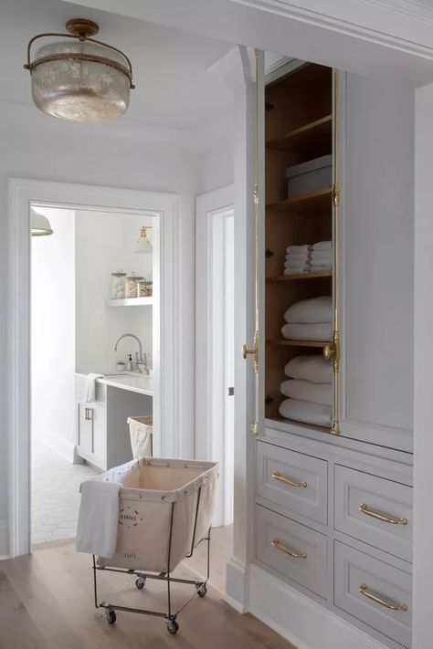 Transitional Laundry Room, Grey Floating Shelves, Laundry Cabinet, Grey Laundry Rooms, Patterned Tile Backsplash, Light Gray Cabinets, Grey Shelves, White Subway Tile Backsplash, Linen Cabinets