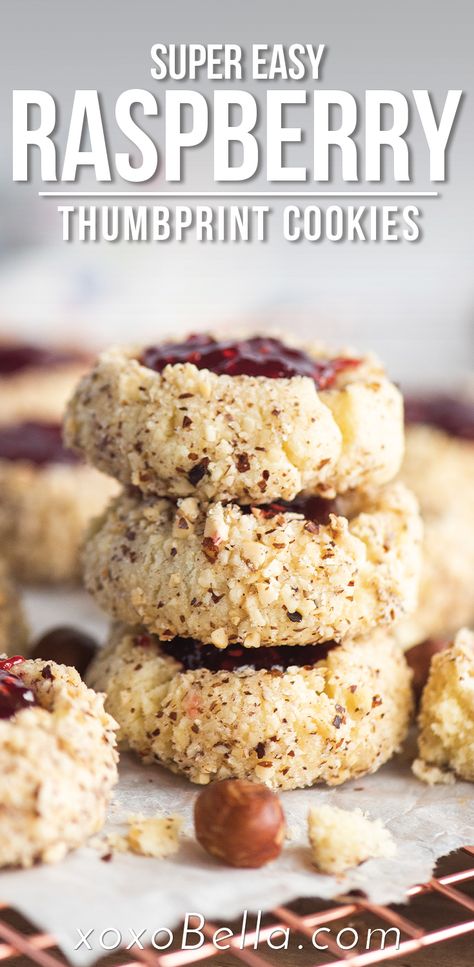 image of thumbprint cookies with jam and hazelnuts. Hazelnut Thumbprint Cookies, Raspberry Jam Cookies, Thumbprint Cookies With Jam, Fluffy Cookies, Cookies Raspberry, Summer Cookie Recipes, Cookies With Jam, Lemon Ricotta Cookies, Raspberry Thumbprint Cookies