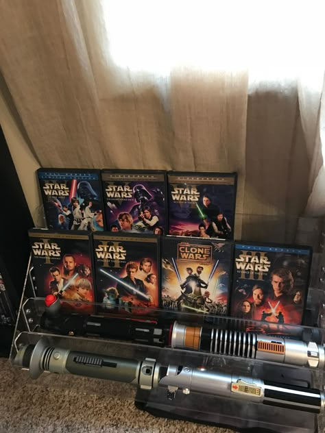 My new Star Wars lightsaber and DVD Display Star Wars Fan Aesthetic, Lightsaber Aesthetic, Movie Star Aesthetic, Star Wars Collection Room, Star Wars Desired Reality, Dvd Display, Life Sabers Star Wars, Star Wars Movies In Order, Star Wars Collectibles