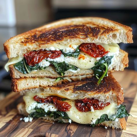 Let's be honest - is there anything more comforting and nostalgic than a classic grilled cheese sandwich? That first hot, crispy bite transports you right back to childhood. But as amazing as the original is, Spinach Dip Sandwich, Tuscan Grilled Cheese, Sun Dried Tomato Spinach Grilled Cheese, Ricotta Grilled Cheese Sandwiches, Ricotta Cheese Sandwich, Grilled Tomato Sandwich, Ciabatta Grilled Cheese, Chibatta Sandwiches Dinners, Sundried Tomato Sandwich