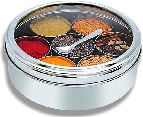 RADITIONAL SPICE BOX: Product Contains 1 Spice Box which includes 7 small container,1 spoon and See Through lid. SPICE SEPARATELY - Seven individual compartments to store all your authentic spice separately with Steel lid care for spices Spice Box Each inside container hold 75 g of spice. This Stainless Steel Masala Dabba is a traditional container that can be found in most Indian homes to store and provide easy access to most commonly used spices. Indian Spice Box, Masala Dabba, 7 Spice, Round Gift Boxes, Spice Rack Organiser, Spice Storage, Spice Box, Spice Containers, Spice Jar