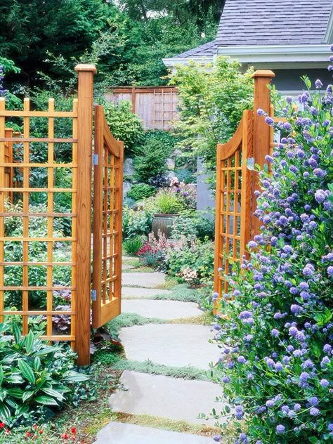 An easygoing path leads the way to a welcoming garden oasis: http://www.bhg.com/gardening/landscaping-projects/landscape-basics/path-and-walkway-landscaping-ideas/?socsrc=bhgpin052414gardengate&page=1 Gate Arbor, Garden Arbor With Gate, Garden Gate Design, Walkway Landscaping, Sloped Garden, Garden Arbor, Wooden Gates, Pergola Plans, Garden Oasis