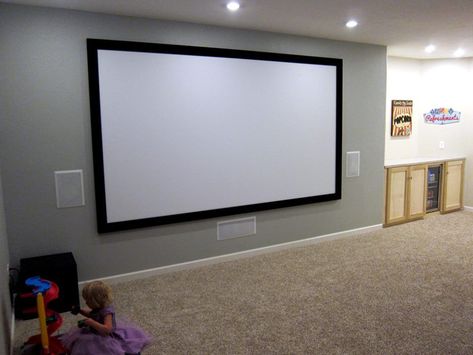 Basement home theater ideas. 135" fixed frame screen. Pioneer in-wall speakers. View the before and after pictures of this DIY basement home theater project! Home Theater Basement, Home Theater Screens, Home Theater Ideas, Theatre Diy, Basement Paint Colors, Wall Speakers, Basement Painting, Basement Home Theater, Basement Home