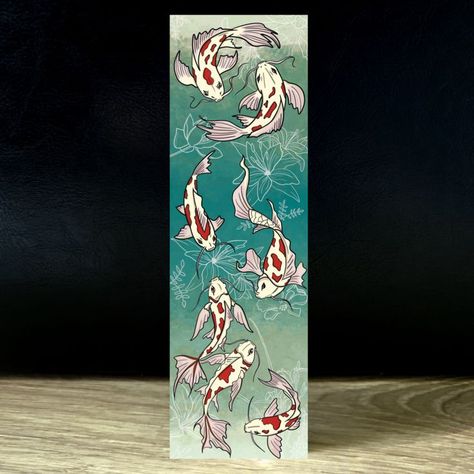 Koi fish on the bookmark going up and down. A blue bookmark and a red bookmark are shown on the images. Japanese Bookmarks Art, Koi Fish Bookmark, Etsy Bookmarks, Koi Fish Japanese, Fish Japanese, Japanese Koi Fish, Bookmarks Diy, Handmade Bookmarks Diy, Koi Watercolor