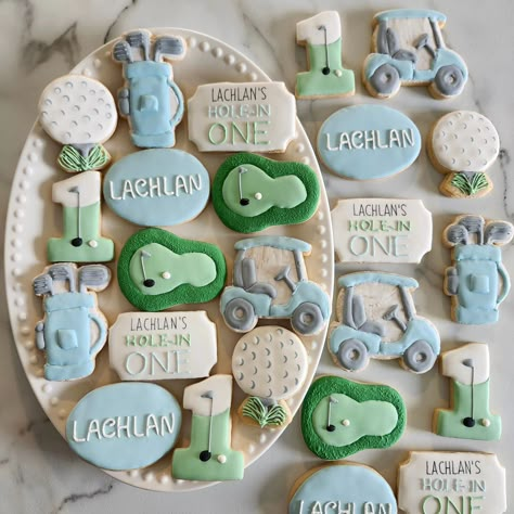 Hole in One - Happy Birthday Lachlan ⛳️🏌️‍♀️ Golf Cookies 💙 • • #cookie #cookies #decoratedcookies #cookiesofinstagram #cookiehack #cookietip #cookiedecorating #satisfying #satisfyingreel #cookier #newcolors #thisweekscolors #jdsugarcookies #lachlan #golf #golfsugarcookies #golfcookies #golfcookieset #holeinone #holeinonecookies #golfclub #golfball #golfballcookies #sugarcookie #sugarcookies #royalicing #sugarcookiesofinstagram Hole In One Cupcakes, Hole In One Cookies, Golf Cookies, Golf First Birthday, Golf Birthday Cakes, Boys Golf, Golf Birthday Party, Cookie Hacks, Golf Party