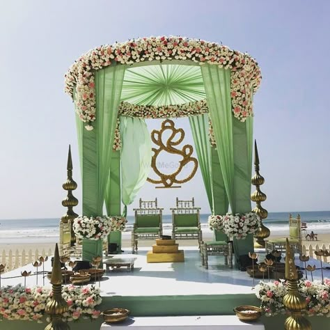 A floral mandap decor with green curtains Bengali Wedding Mandap, Indoor Mandap, Floral Mandap Decor, Mandap Decoration Ideas, Green Beach Wedding, Floral Mandap, Hindu Wedding Decorations, Indian Wedding Decorations Receptions, Indian Wedding Ideas