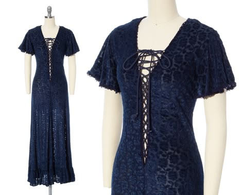 "♡ PLEASE ENLARGE PHOTOS FOR MORE DETAIL ♡ D E T A I L S * very early 1970s maxi dress - RARE! * hourglass shape * burnout velvet with a floral design * feels like a mix of cotton + rayon * gorgeous navy blue color * crochet trim * v-neckline * short flutter sleeves * plunging lace-up corset front; can be tied up as high or low as you want * very slight a-line shaped skirt * ruffled tier at hem of skirt * no other closures besides lace-up front * unlined + sheer; a slip is recommended * label: Jessica | Gunne Sax  M E A S U R E M E N T S fits like a: x-small | small shoulders: 15\" bust: adjustable | about 30-36\" waist: adjustable | about 26-28\" hips: 33-36\" length: 55\" sleeve length: 7\" C O N D I T I O N Very good vintage condition. Ready to wear! There was one very small hole on bac Patterned Dresses, 70s Mode, Sax Dress, Gunne Sax Dress, Blue Corset, Vintage Dress 70s, Lace Up Corset, Dress 70s, Burnout Velvet