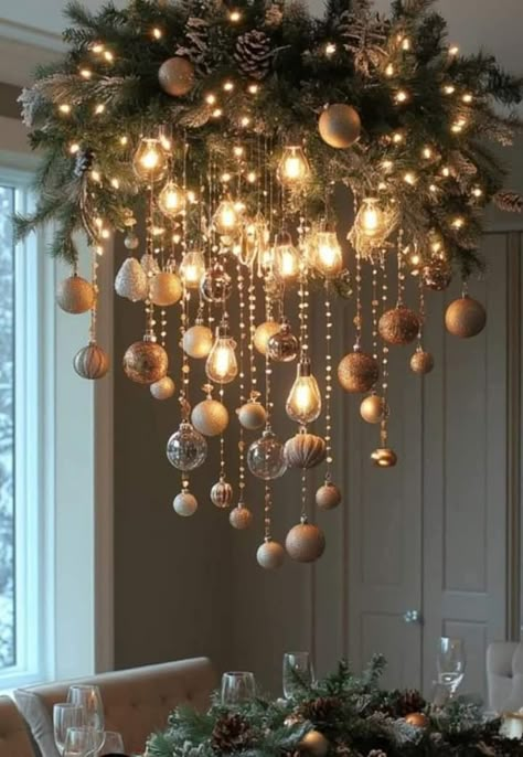 Christmas Ornament Chandelier Diy, Hanging Christmas Ornaments From Chandelier, Christmas Bulb Chandelier, Christmas Light Ceiling Decor, Chandeliers Decorated For Christmas, Christmas Ornaments On Chandelier, Christmas Decorations Chandelier, Christmas Decor For Dining Room Light, Hanging Light Christmas Decor