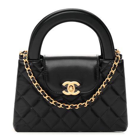 This is an authentic CHANEL Shiny Aged Calfskin Quilted Nano Kelly Shopper in Black. This mini bag is a twist on an archival Chanel bag, featuring a long crossbody chain strap. This dual top handle bag is quilted in shiny aged calfskin leather in black, accented by aged gold hardware, including a Chanel CC turn-lock at the flap. This opens to a compact black leather interior with zipper and flat pockets. Chanel Mini Kelly, Archival Chanel, Chanel Kelly, Chanel Mini Bag, Dream Bags, Chanel Mini, Kelly Bag, Handle Bag, Leather Interior