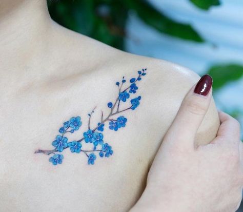 Blue cherry blossom tattoo along the collarbone | www.otziapp.com Blue Flower Tattoos, Bone Tattoo, Tattoo Nature, Butterfly Tattoos For Women, Music Tattoo Designs, Flower Tattoo Shoulder, Small Girl Tattoos, Tatuaje A Color, Blossom Tattoo