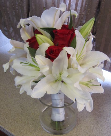 White Lilies and Red Roses Bridal Bouquet Red Rose Wedding Centerpieces, Red Rose Centerpiece Wedding, Red Rose Centerpieces, Wedding Flowers Lilies, Rose And Lily Bouquet, White Lily Bouquet, Red Rose Bridal Bouquet, Red Rose Bouquet Wedding, Red Roses Centerpieces