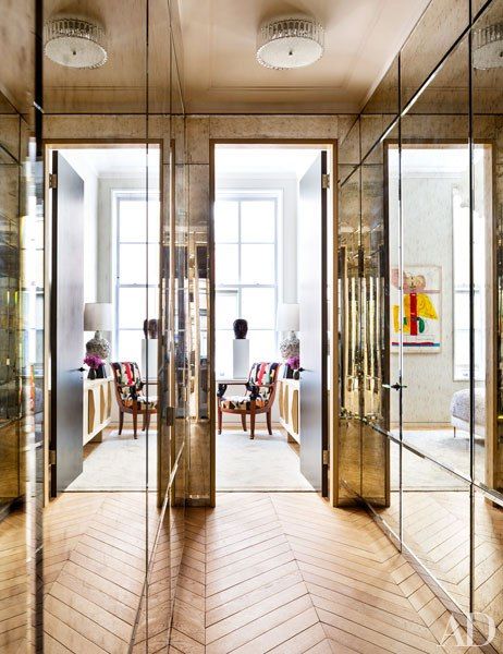 Antiqued mercury glass sheathes a hallway fitted with H. Theophile door hardware at the Manhattan home of architect Steven Harris and interior designer Lucien Rees Roberts New Yorker Loft, Mirrored Walls, Hallway Mirror Wall, Tribeca Loft, Mirrored Doors, Apartment Loft, Manhattan Apartment, Loft Decor, New York Apartment