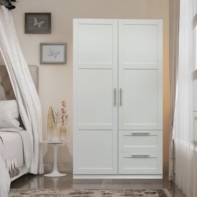 The size of this wardrobe is 39.37W x 19.49D x70.87H. This wardrobe is ideal for bedroom use, offering a huge amount of storage space. Color: White | Loon Peak® Foah Armoire Wood in White, Size 70.87 H x 39.37 W x 19.49 D in | Wayfair Armoire Wardrobe Closet, Wood Armoire, Pantry Cupboard, Wood Wardrobe, Closet Colors, Bedroom Armoire, Wardrobe Cabinets, Wardrobe Armoire, Kitchen Features