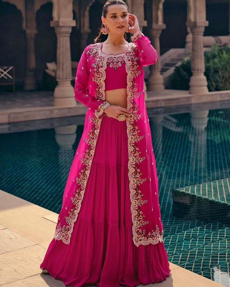 Party Wear Lehenga Choli With Long Shrug Style Koti https://www.urmifashion.com/lehengas/koti-style-lehenga-choli/rani-pink-real-chinon-silk-koti-style-lehenga-choli-uf167-3 #lehenga #lehengacholi #lehengacholionline #lehengas #lehengalove #stylishlehenga #partywearlehenga #designerlehenga #festive #festivewear #lehengalove #festivecollection #onlinestore #indianclothing #clothingstore #clothing #clothingforwomen #fashionstyle #shopping #ethnicwear #womenclothing #partywear #designer #trendi... Jacket Lehenga Long, Lehenga With Long Jacket, Long Choli Lehenga, Jacket Lehenga, Saree With Belt, Georgette Lehenga, Rani Pink, Lehenga Suit, Party Wear Lehenga Choli