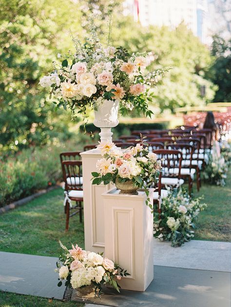 Flower Pedestals Wedding Aisle, Florals On Columns, Wedding Ceremony Floral Urns, Flower Pots For Wedding Ceremony, Chandelier Arbor Wedding, Top Wedding Flowers, Flowers On Columns Wedding, Floral Risers Wedding, Wedding Ceremony Podium Flowers