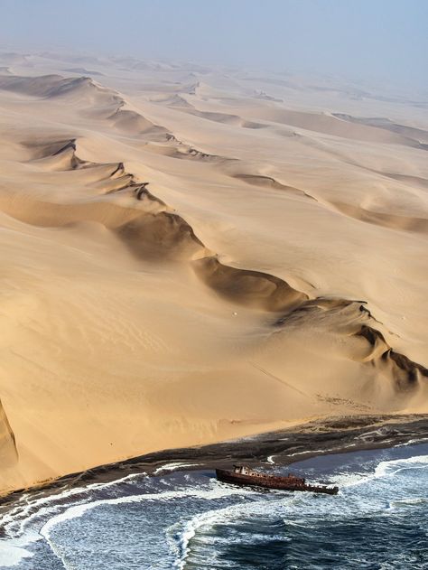 🇳🇦 The “Shawnee,” an American vessel that wrecked on Feb. 16, 1976, sits in surf along the Skeleton Coast of Namibia 🚢 Namibia Photography, Aesthetic Location, Gunung Mulu National Park, Desert Plains, Sand Man, Skeleton Coast, Namibia Travel, Etosha National Park, Chobe National Park