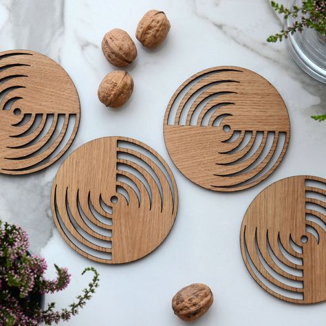 "Protect your furniture surfaces from ugly stains with our wooden coasters. Looking snazzy and protecting your table at the same time, they do the hard work while keeping your surfaces pretty. Our coasters are perfect to keep condensation contained and protect furniture from drips. Four natural wood coasters are sanded and finished with a food safe oil. A natural addition to the modern organic table, our rustic modern wooden coasters have a warm natural oak look. Classic yet artisanal in feel, t Coasters Design, Trivets Diy, Laser Cut Coaster, Organic Table, Living Room Clocks, Laser Cut Wood Crafts, Veneer Panels, Tea Coaster, Table Coasters