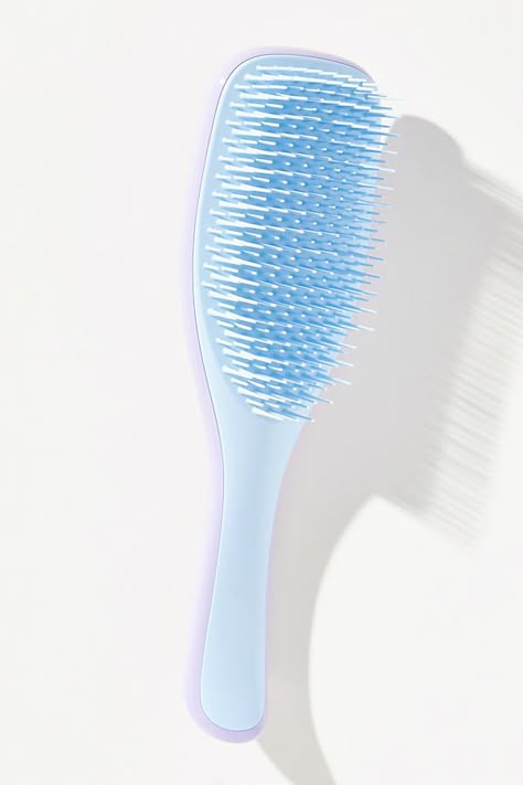 The Ultimate Detangler by Tangle Teezer effortlessly slips through your hair (and thanks to its handle, not out of your wet hands). The patented two-tiered teeth technology is gentle on vulnerable, shower-fresh hair, meaning less breakage, more of that running-your-fingers-through-your-hair feeling. | The Ultimate Detangler Brush by Tangle Teezer in Blue, Women's, Plastic at Anthropologie Hair Detangler Brush, Tangle Teaser Hairbrush, Blue Christmas Gifts, Tangle Teaser Brush, Cute Hairbrush, Tangle Teezer Brush, Tangle Teaser, Preppy Things To Buy, Blue Wishlist