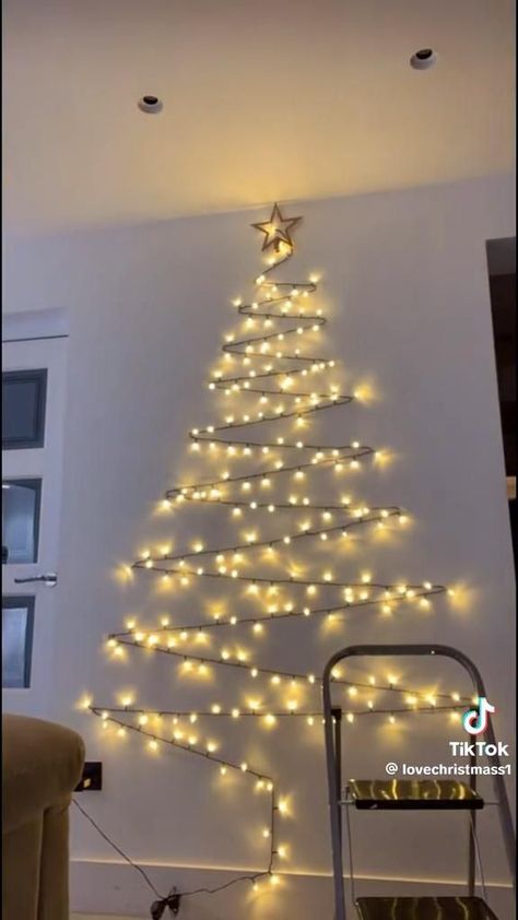 Christmas Light Trees On Wall, Christmas Tree From Lights, String Light Christmas Tree On Wall, Lights In Shape Of Christmas Tree On Wall, Christmas Trees In Small Spaces, Wall Decoration For Christmas, Christmas Tree With Lights On Wall, Flat Wall Christmas Tree Ideas, Wall Christmas Tree Lights