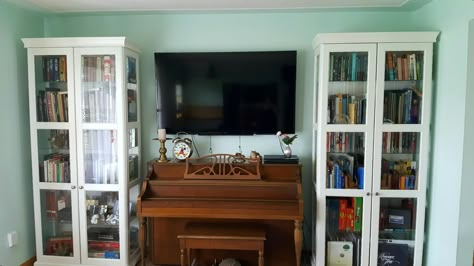 Living room bookcases ikea with 60" tv over piano. Tv On Piano, Piano Tv Stand, Tv Over Piano Living Rooms, Tv Above Piano Living Rooms, Piano Under Tv, Tv Over Piano, Tv Above Piano, Bookcases Ikea, Piano Storage