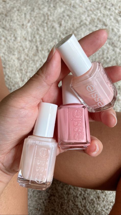 Holding three different shades of nail polish bottles from Essie, a very light pink, a baby pink and a darker pink, the shades are Mademoiselle, groove is in the heart, hi maintence nail polish from left to right. Baby Pink Nail Polish, Light Pink Nail Polish, Nail Polish Gift, Cute Nail Polish, Baby Pink Nails, Organizer Ideas, Nail Polish Organizer, Light Pink Nails, Professional Manicure