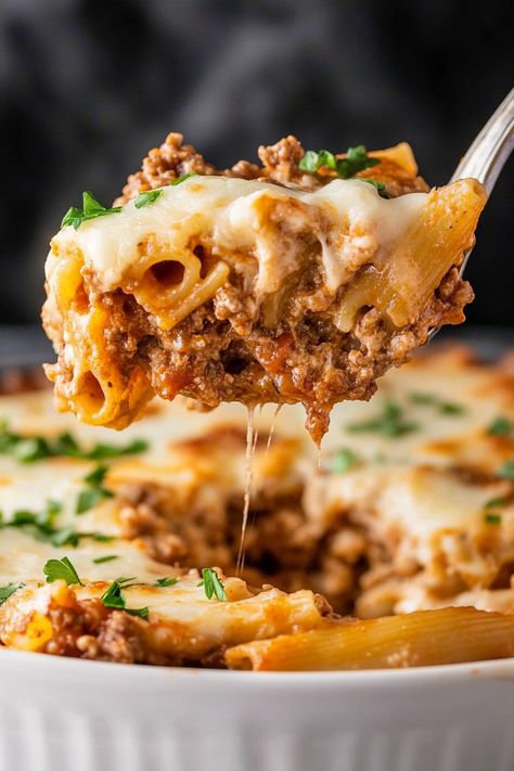 This million dollar baked ziti features a decadent combination of four cheeses, meat sauce, and tender pasta. It's creamy, cheesy and oh-so-comforting. Italian Recipes Beef, Baked Ziti Authentic, Baked Ziti With Mushrooms, Baked Ziti Instapot, White Sauce Baked Ziti, Turkey Ziti Bake, Baked Ziti Turkey Meat, Baked Pasta Recipes With Ground Beef, Quick And Easy Italian Dinner Recipes