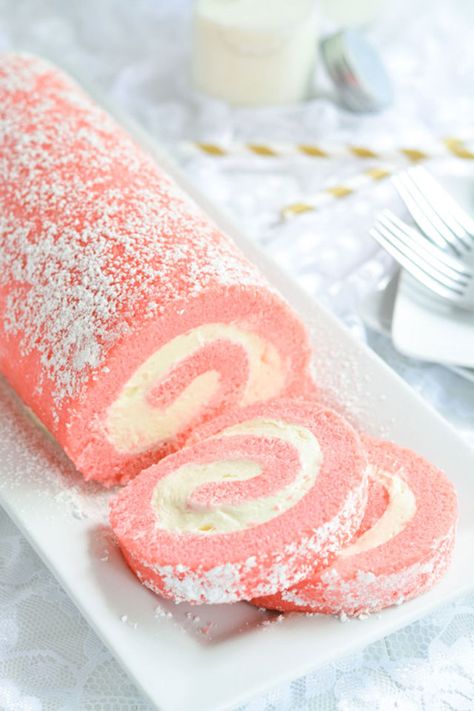 A cake roll is a light and fluffy alternative to traditional cupcakes or cake. With powdered sugar on top and a cream cheese interior, it's a pastel-pretty party dessert. Get the recipe at Garnish and Glaze.   - CountryLiving.com Baby Shower Desserts Girl, Super Torte, Mothers Day Desserts, Cake Roll Recipes, Pink Desserts, Dessert Simple, Shower Desserts, Roll Recipes, Dessert Party