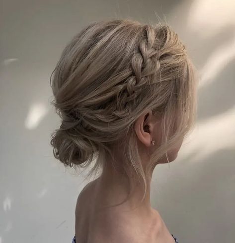 23 Easy Messy Bun Hairstyles You Can Try In Minutes Messy Low Side Bun Wedding, Messy Low Bun Wedding Short Hair, Low Bun With Braid Short Hair, Bridal Low Bun Short Hair, Bridesmaid Side Bun Hairstyles, Formal Low Bun For Short Hair, Tousled Low Bun Wedding, Low Bun With Curtain Bangs Wedding, Low Messy Bun Formal