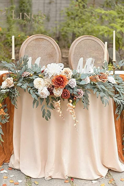 Garlands make for impressive sweetheart table decorations. This one shown below in terracotta is composed of high quality artificial flowers, eucalyptus and willow leaf as well as iron wires hidden in the plastic stems to make bending easy. This lovely garland is also available in pink and dusty rose. Head Table Decor, Sweetheart Table Wedding, Floral Swag, Future Wedding Plans, Vintage Wedding Decorations, Flower Garland, Head Table, Sweetheart Table, Wedding Cake Designs