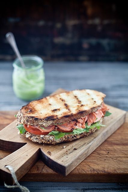 Grilled salmon sandwich with pesto avocado spread. Grilled Salmon Sandwich, Sandwiches With Pesto, Sandwich With Pesto, Salmon Sandwiches, Salmon Sandwich, Avocado Spread, Soup And Sandwich, Burgers Sandwiches, Grilled Salmon