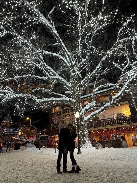 Christmas couple. Christmas tree. Christmas lights. Snow. Leavenworth. Christmas things. Travel. Holiday travel. Christmas town. Couple things. Kiss In Snow, Christmas Romcom Aesthetic, Christmas Lights Couple Pictures, Christmas Couple Activities, Romantic Christmas Aesthetic, Christmas Romance Aesthetic, Winter Wonderland Couple, Christmas Relationship Aesthetic, Christmas Lights Date