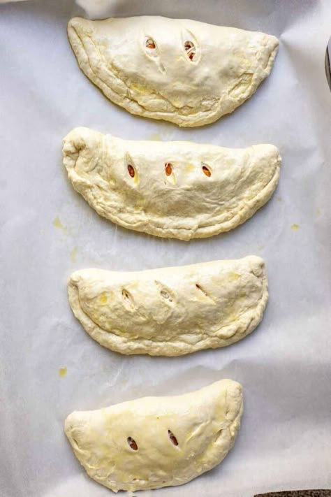 Take pizza night up a notch with these sourdough calzones. Made with a flavorful sourdough crust, fill each calzone with sauce, cheese, and your favorite pizza toppings, like red onion, green peppers, or sausage - the options are endless! #FarmhouseonBoone #SourdoughCalzone Sourdough Calzone Dough, Sourdough Calzone, Sourdough 101, Calzone Recipe Easy, Sourdough Crust, Sourdough Ideas, Recipe Using Sourdough Starter, Sourdough Pizza Crust, Calzone Recipe