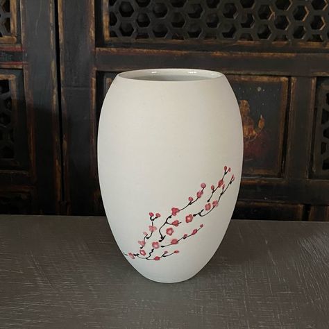 The flip side of a cherry blossom vase in bare porcelain. I love how the bare porcelain accentuates the cherry blossoms and it’s really easy to photograph since it’s not shiny lol . . . . #cherryblossom #cherryblossoms #porcelain #wheelthrownporcelain #ceramicsofinstagram #handpaintedporcelain #handmadewithlove #vase #porcelainvase Cherry Blossom Vase, Painted Pottery, Hand Painted Pottery, Hand Painted Porcelain, Porcelain Vase, Pottery Painting, Wheel Thrown, Cherry Blossoms, Cherry Blossom