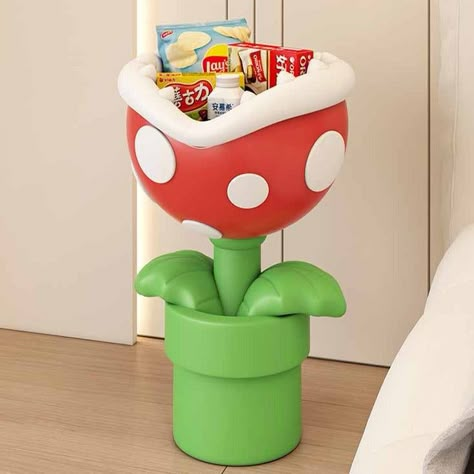 Introducing the Mario Flower Statue Standing Ornament - the perfect addition to your home decor collection! This ornament features a cute and quirky Cartoon big mouth flower design, with colorful beancurd accents that will brighten up any room.   Crafted from high-quality resin and handcrafted with precision, this floor ornament is built to last and will serve as both a decorative piece and a storage solution. It is designed in a modern Nordic style that will fit seamlessly into any living room, Kirby Bedroom Decor, Mario Bedroom Decor, Mario Kart Room Decor, Weird Core Room, Mario Bathroom Decor, Mario Bros Furniture, Weird Room Decor, Super Mario Home Decor, Quirky Room Decor