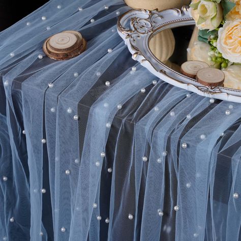 PRICES MAY VARY. Polyester, Nylon EXTRA LONG PEARL TABLE RUNNER: OSVINO pearl table runner is made of soft chiffon veil with smooth pearls, the fabric is soft and smooth, light like butterfly wings, durable and reusable; 10 Feet length is the best choice for wedding table decoration, arch decoration, bridal veil. ROMANTIC WEDDING DECORATIONS: Wideth 63"(160cm) x Length 120"(300cm), this size can be freely decorated on wedding party tables of all sizes, rustic tablecloths with gorgeous pearls dra Pearl Table Runner, On Cloud 9 Bridal Shower Theme Backdrop, Hanukkah Brunch, Pearl Tulle Table Runner, Pale Blue Bridal Shower Ideas, Pearl Party Decorations, White Tablecloth With Dusty Blue Runner, Blue Chiffon Table Runner Wedding, Bridal Shower Light Blue