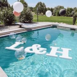 Pool Decor For Engagement Party, Pool Decorations For Engagement Party, Floating Initials In Pool, Engagement Pool Party Decorations, Wedding Party Decorations Outdoor, Pool Floaters For Wedding, Backyard Pool Engagement Party, Large Letters For Party, Anniversary Party Decorations Outdoor