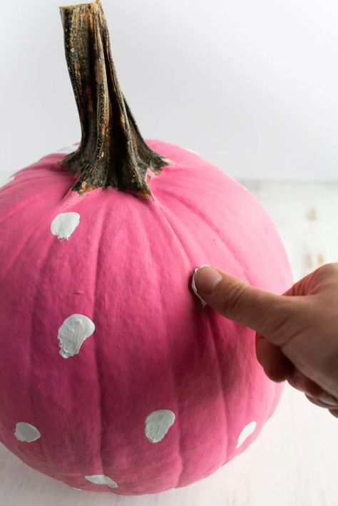 Pink painted pumpkin with thumbs pressing on white paint on it that looks like small ghosts Painting Pumpkins Ideas Aesthetic, Painted Pink Pumpkins, Pumpkin Painting Girly, Mini Pumpkin Painting Ideas Easy, Girly Painted Pumpkins, Painting Pumpkins Ideas Diy Girly, Girly Pumpkin Painting Ideas, Pink Pumpkin Painting Ideas, Pumpkin Painting Ideas Pink