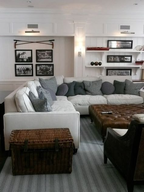 Display old sporting equipment or even vintage tools on the wall or bookcase. Monochromatic pillows add texture in a mix of wool and linen. Wainscoting Wall Paneling, White Wainscoting, Grey Sectional Sofa, Cozy Basement, Family Room Design, Rec Room, A Living Room, Basement Remodeling, Great Rooms