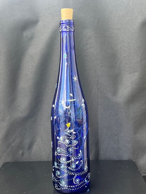 Whimsical Winter Christmas Tree - Etsy Blue Bottles Ideas, Paintings Of Christmas Lights, Painted Blue Wine Bottles, Glass Bottle Christmas Crafts, Christmas Wine Bottle Painting, Painted Christmas Wine Bottles, Mandela Ideas, Painting Bottles, Christmas Bottles