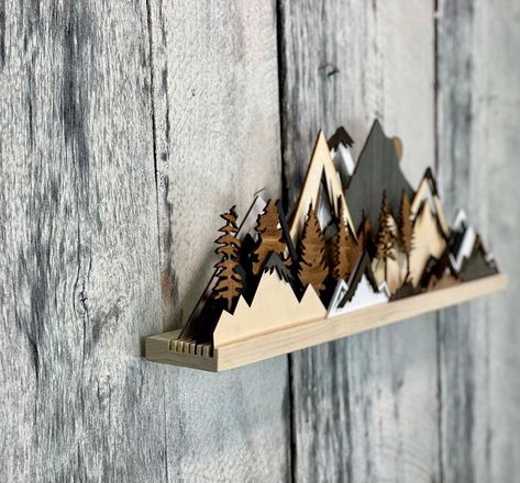 Create stunning mountain wood art sculptures that enhance your home decor. Perfect for nature lovers looking to add a touch of the outdoors to their space! Mountain Sculpture, 3d Forest, Hood Range, Mountain Wood Art, Mountain Scape, Art Shelf, Laser Cut Wood Crafts, Wood Art Projects, Mountain Decor