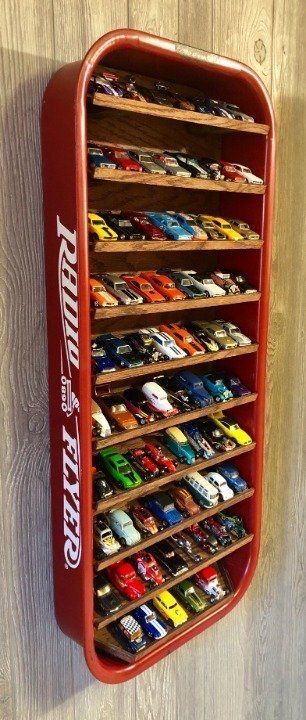 Hot Wheels Bathroom Ideas, Big Toy Car Storage Ideas, Big Toy Truck Storage Ideas, Powerwheel Storage, Monster Truck Wall Storage, Monster Truck Shelf, Monster Truck Shelves, Storing Hot Wheels, Monster Truck Storage