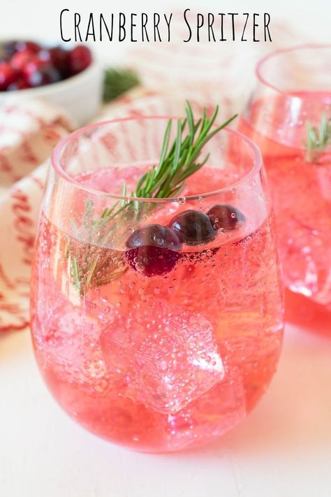 This classic cranberry spritzer is easy to make and goes down a treat! It's perfect for any season of the year. Wine Spritzer Recipe Holidays, Cranberry Limoncello Spritzer, Sparkling Holiday Drinks, Sparkling Cocktail Recipes, Cranberry Spritzer Non Alcoholic, Christmas Wine Spritzer, Cranberry Wine Spritzer, Christmas Spritzer Drink, Holiday Spritzer Drinks