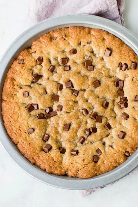 The BEST soft and chewy giant chocolate chip cookie cake. Perfect as a birthday cake!