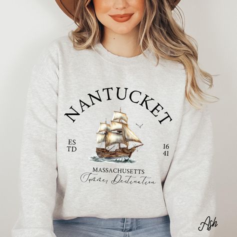 Cozy Nantucket sweatshirt for coastal lovers! This preppy crewneck is perfect for a Nantucket island vacation, girl trips, or family travel. A great Nantucket gift featuring a classic design inspired by the Massachusetts coast, lighthouses, and beach vibes. ➤➤ Check out more Nantucket Beach-inspired products and designs through the link below. https://www.etsy.com/shop/EmbellishGiftStudio?ref=shop-header-name&listing_id=1873766285&from_page=listing&search_query=nantucket Hello there! 😊👋 If you're on the hunt for some seriously cozy sweatshirts, you've come to the right place! I'm absolutely passionate about what I do, and my mission is to make your shopping experience absolutely perfect. If you ever have any questions, concerns, or just want to chat about my products, feel free to reach