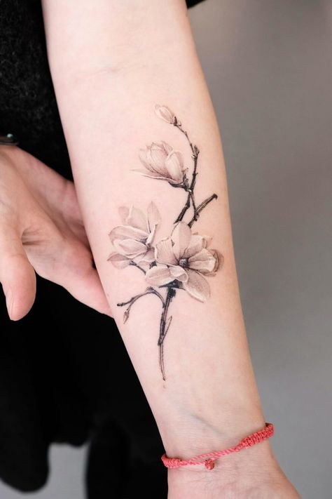 Best Magnolia Tattoos: Ideas, Designs, and Meanings Magnolia Tattoo Leg, Magnolia Bracelet Tattoo, Magnolia Tattoo Sleeve, Magnolia Branch Tattoo, Magnolia Tree Tattoo, Mother Tattoo Ideas, Magnolia Tattoo Design, Magnolia Tattoos, Magnolia Flower Tattoo